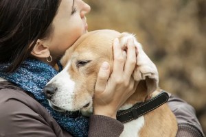 hugging a dog with parasites